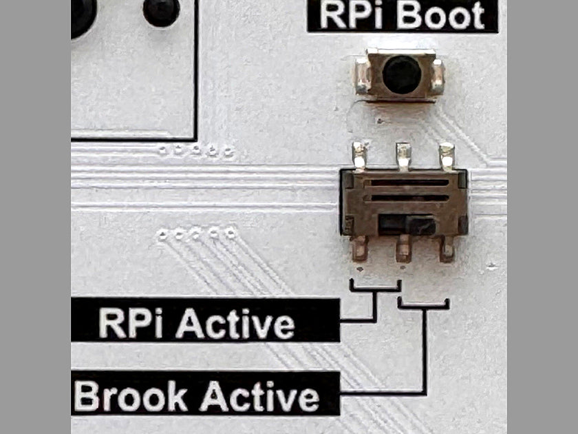Close-up of the SLIDER controller PCB mode switch labeled RPi Boot, RPi Active and Brook Active