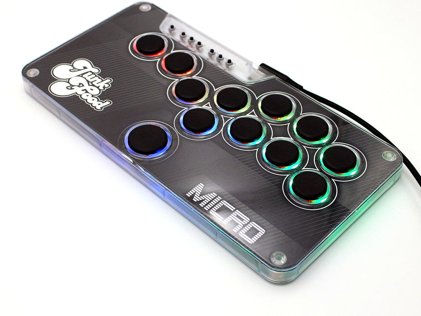Snack Box MICRO leverless FGC fight stick controller with RGB LEDs lit and USB-C cable
