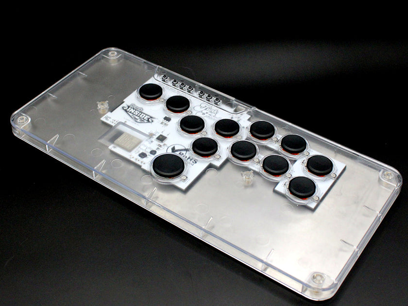 MICRO XL leverless FGC fight stick controller with clear top and black keycaps, alternate angle
