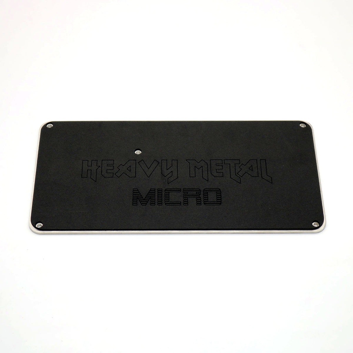 Black Heavy Metal bottom plate etched with Heavy Metal and MICRO logos for the Snack Box MICRO leverless FGC fight stick controller