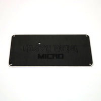 Black Heavy Metal bottom plate etched with Heavy Metal and MICRO logos for the Snack Box MICRO leverless FGC fight stick controller