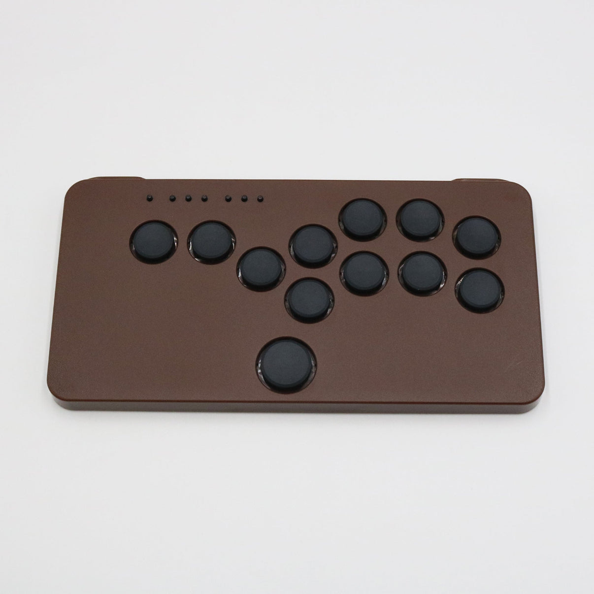 The chocolate brown one-piece case version of the SnackBox Micro from JunkFood Arcades.