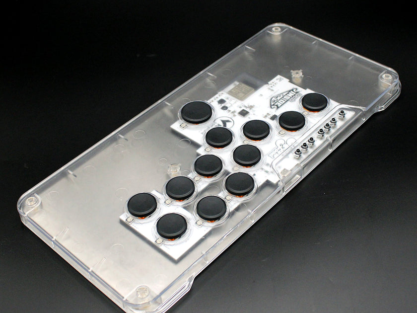 MICRO XL leverless FGC fight stick controller with clear top and black keycaps, third angle