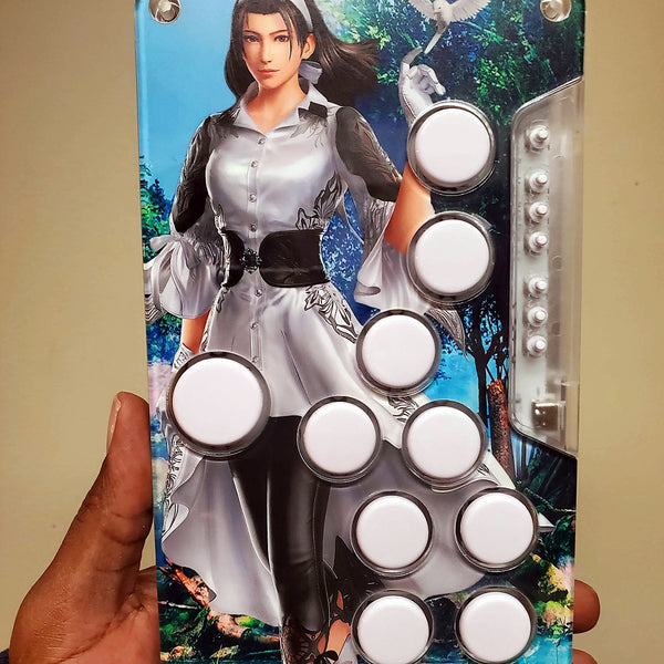 Snack Box MICRO leverless controller with custom character art, held in hand