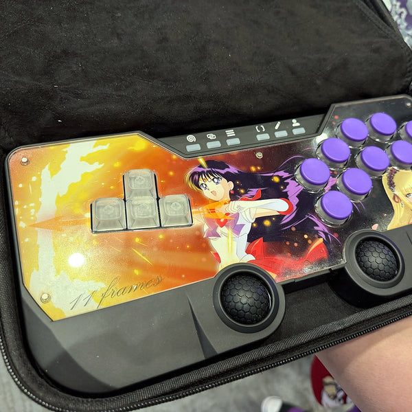 SWORL controller with custom artwork and purple keycaps in its hard-shell case