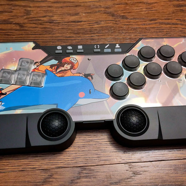 SWORL controller with custom dolphin artwork on a wooden desk